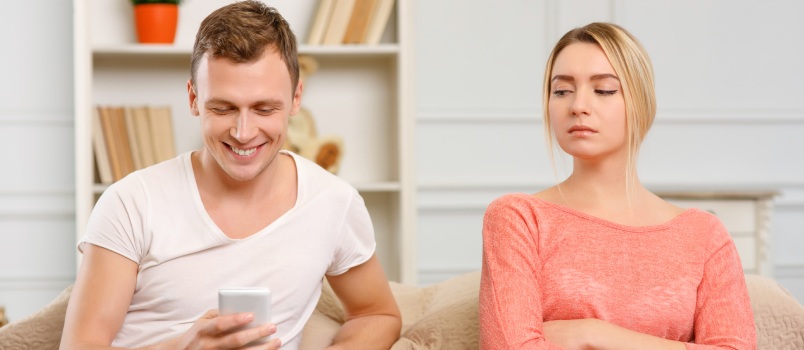 Jealous young woman looking suspicious