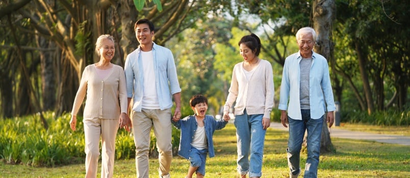 Happy asian family walking