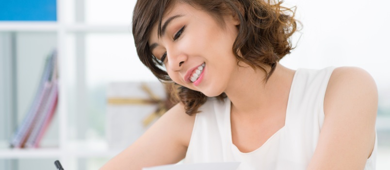 Cute girl writing love letter