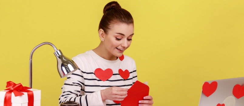 Young woman opening letter