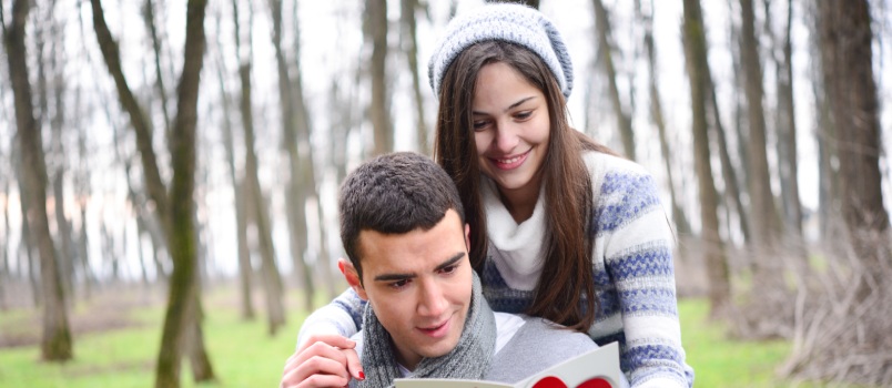 Couple outside reading valentine letter