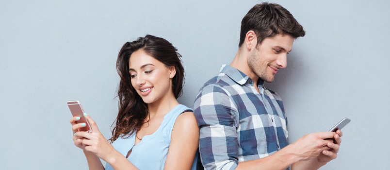 Couple using their smartphone