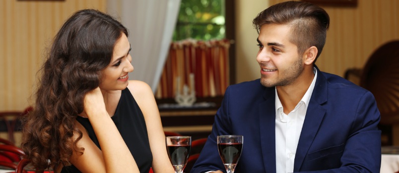 Young couple dating in restaurant