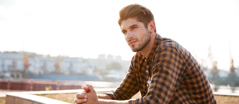 Young man sitting alone