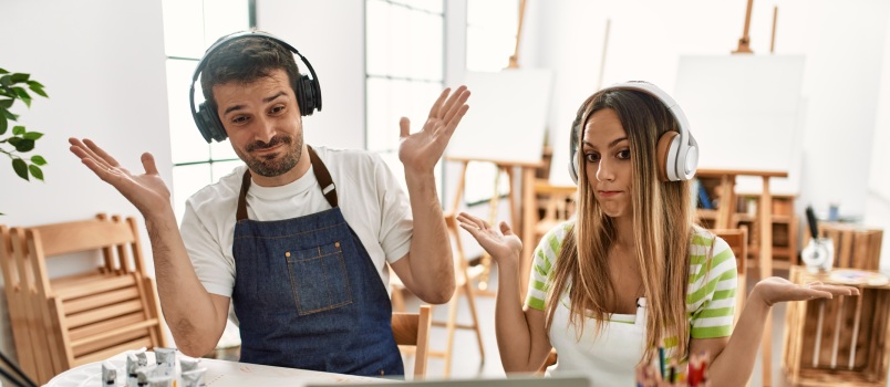 Young couple working in art studio
