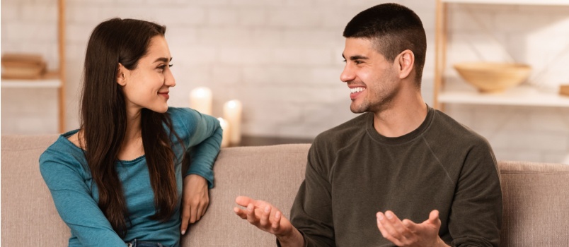 Couple sitting talking to each other