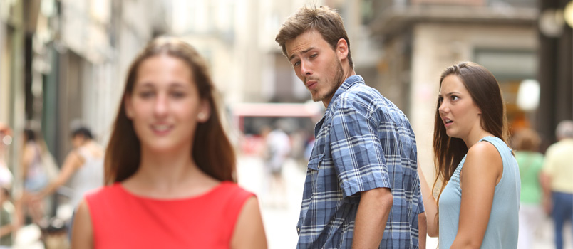 Man looking at another woman while walking with her girlfriend