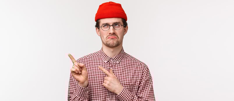 Sad man pointing finger upper side