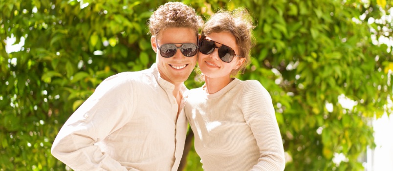 Happy couple wearing sunglasses