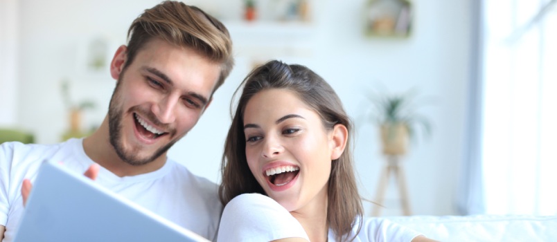 Cheerful couple reading letter