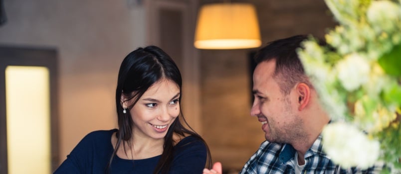 Young couple talking over coffee