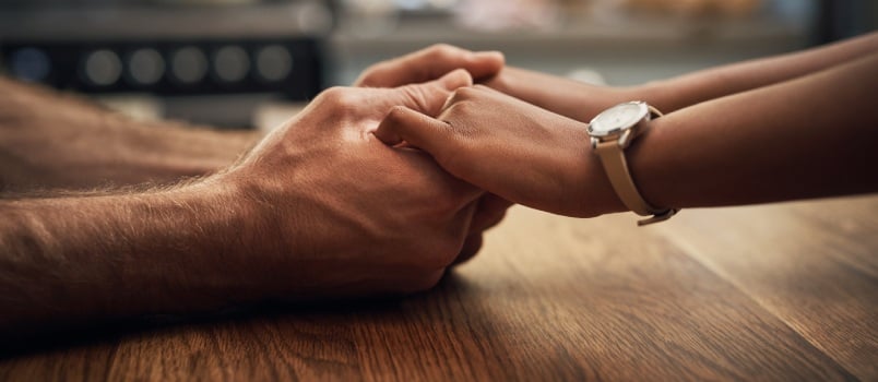 Couple holding each other hands