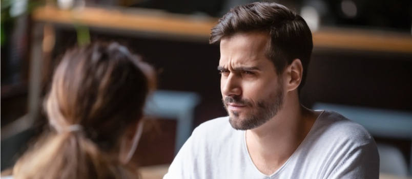 Dissatisfied woman looking bad to man