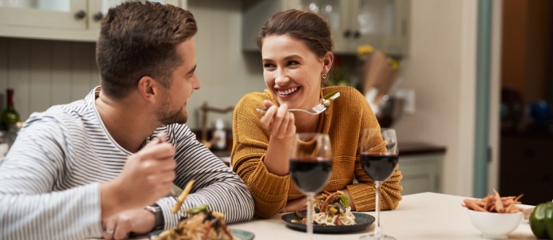 Young couple enjoying their dinner