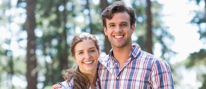 Happy smiling couple looking in camera