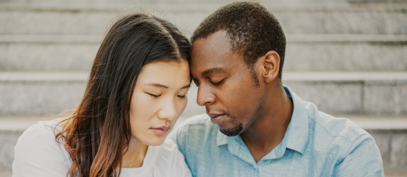Sad couple sitting together