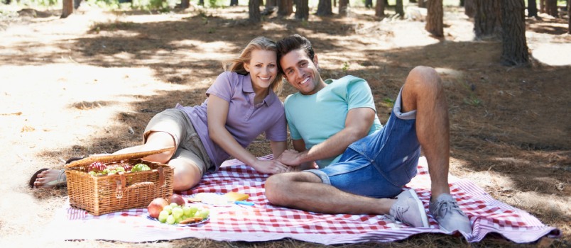 Happy couple enjoying summer picnic