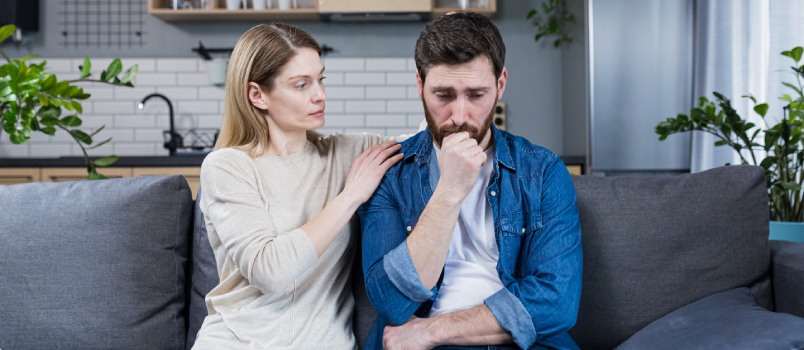 Woman confronting sad man