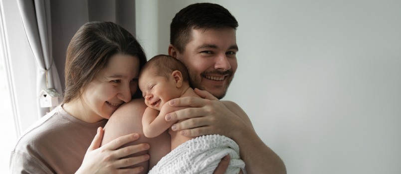 Happy couple enjoying having baby
