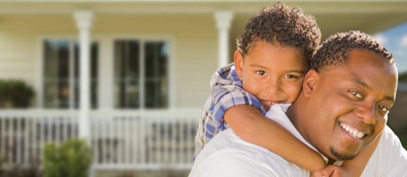 Happy playful father playing with son