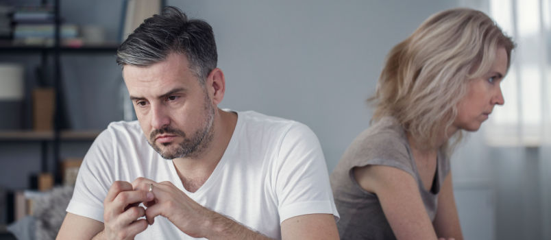 Man taking off his wedding ring
