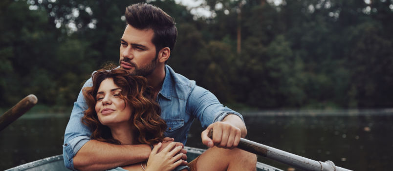 Beautiful couple boating together