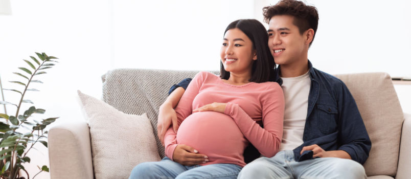 Couple watching TV awaited for baby