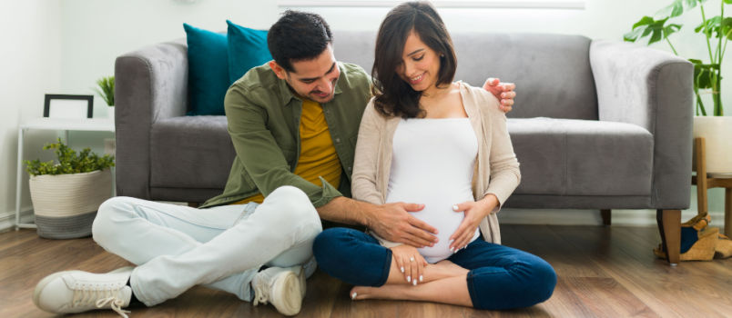 Adorable couple sitting in living room