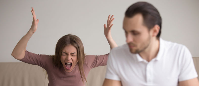 Young woman yelling at man