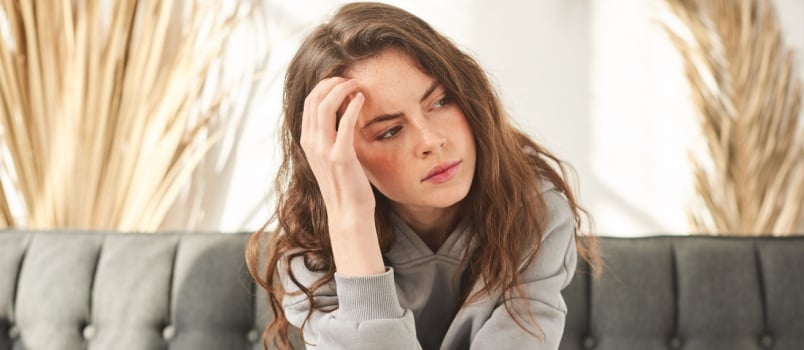 Stressed woman sitting alone