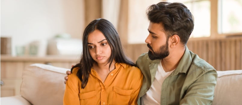 Man comforting woman