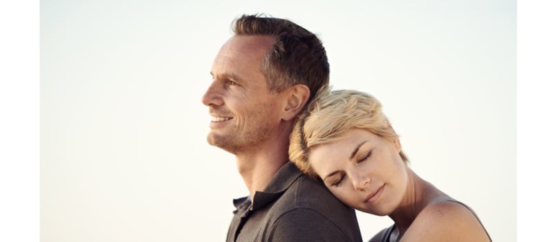 Woman hugging man from back