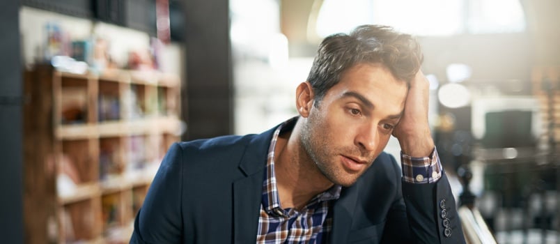 Depressed man sitting at pub