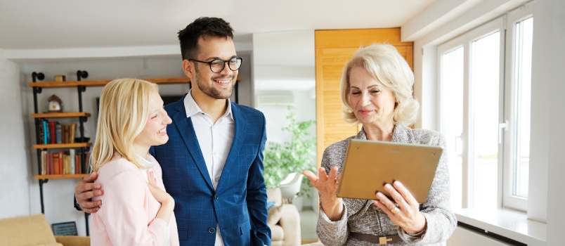 Pretty couple talking with investment agent