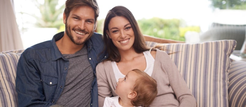 Happy family sitting together 