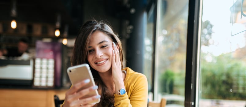 Happy women using smartphone 