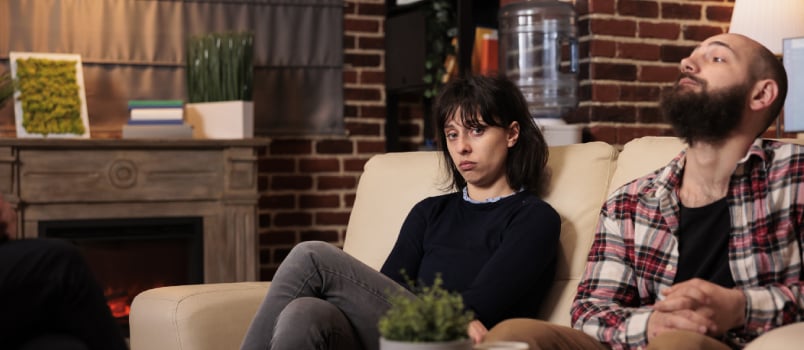 Sad women attending therapy session