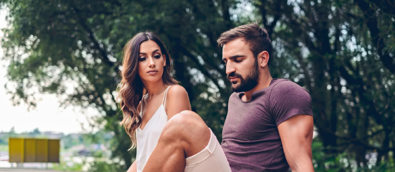 Couple sitting near the lake