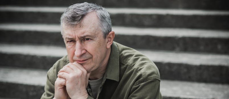 Sad man sitting alone