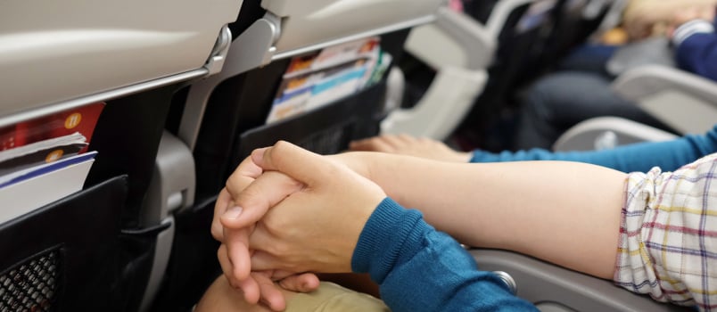 Couple holding hand in flights