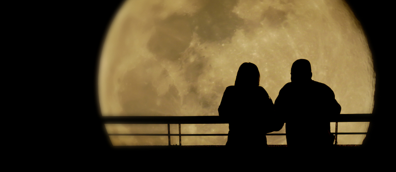 Love couple watching moon