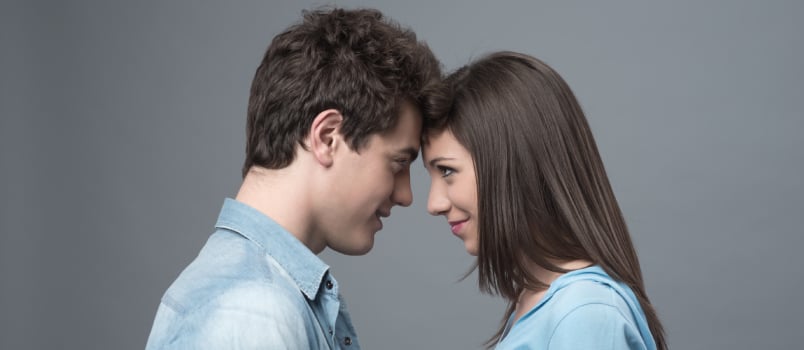 Happy couple touching forehead