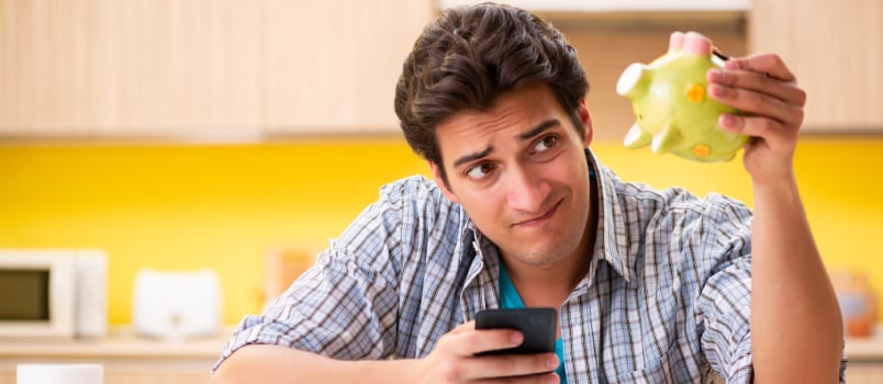 Young man planning monthly budget