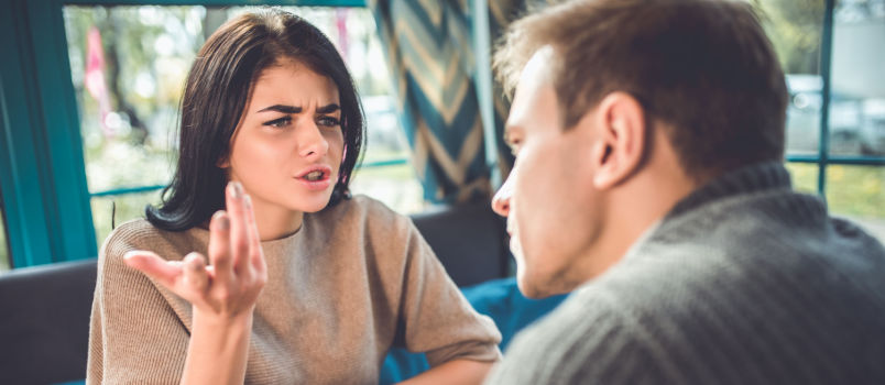 Man and women sitting in cafe