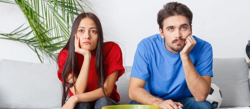 Young couple watching TV