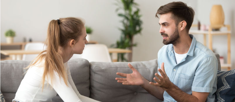 Couple talking sitting on couch