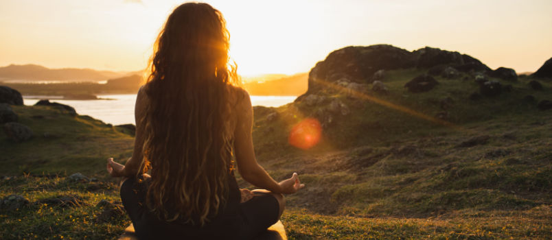 Women meditating alone