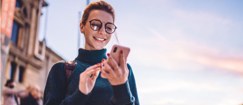 Cheerful women texting