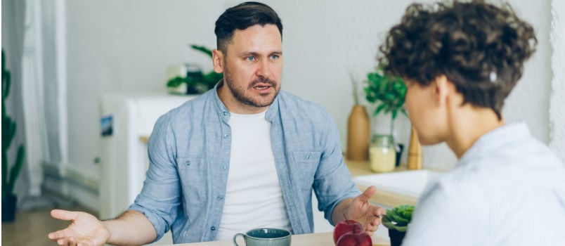 Annoyed man yelling on women