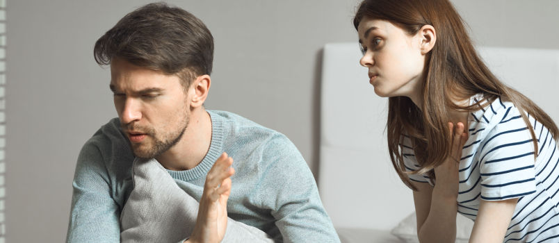 Couple having conflicts in bedroom